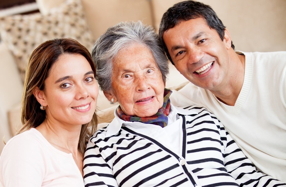 Lovely portrait of a grandmother with her family at home crop