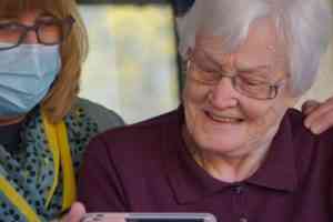 woman in purple polo shirt wearing eyeglasses